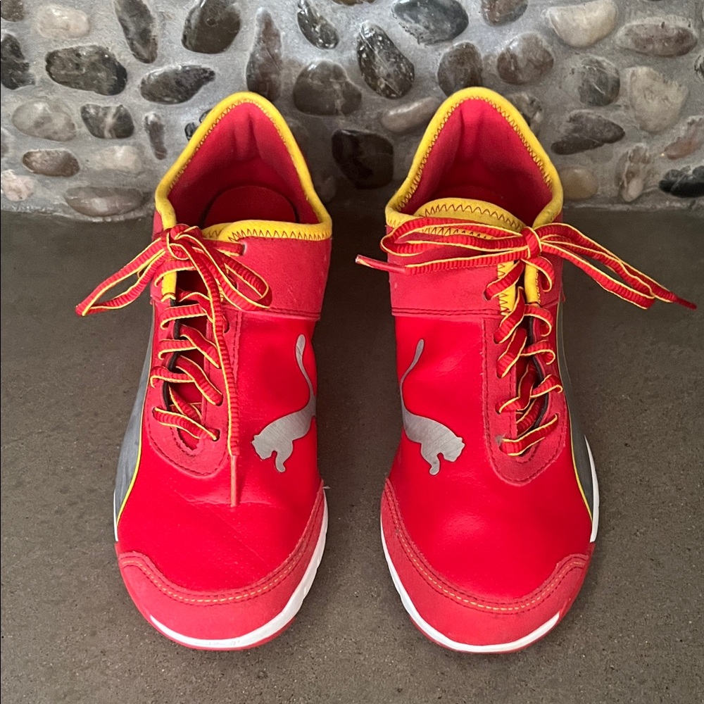 Puma Red Sneakers with Yellow Trim and Silver Logo